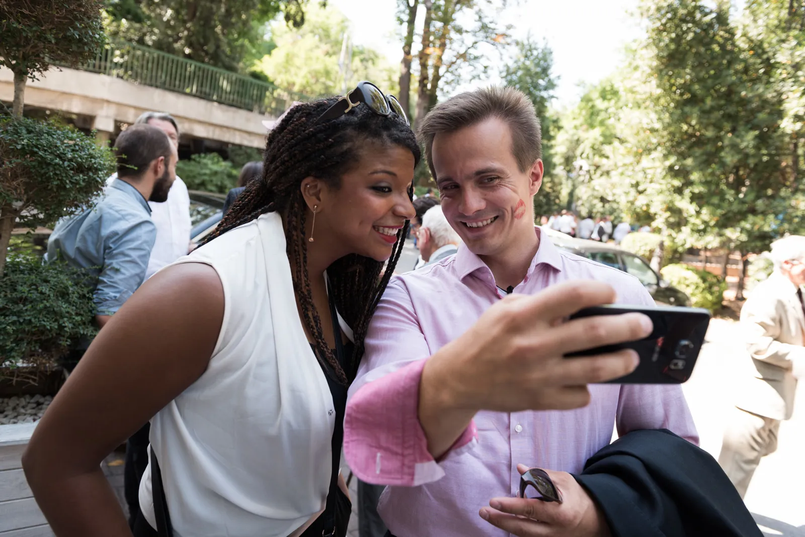 Couple taking a selfie outdoors.