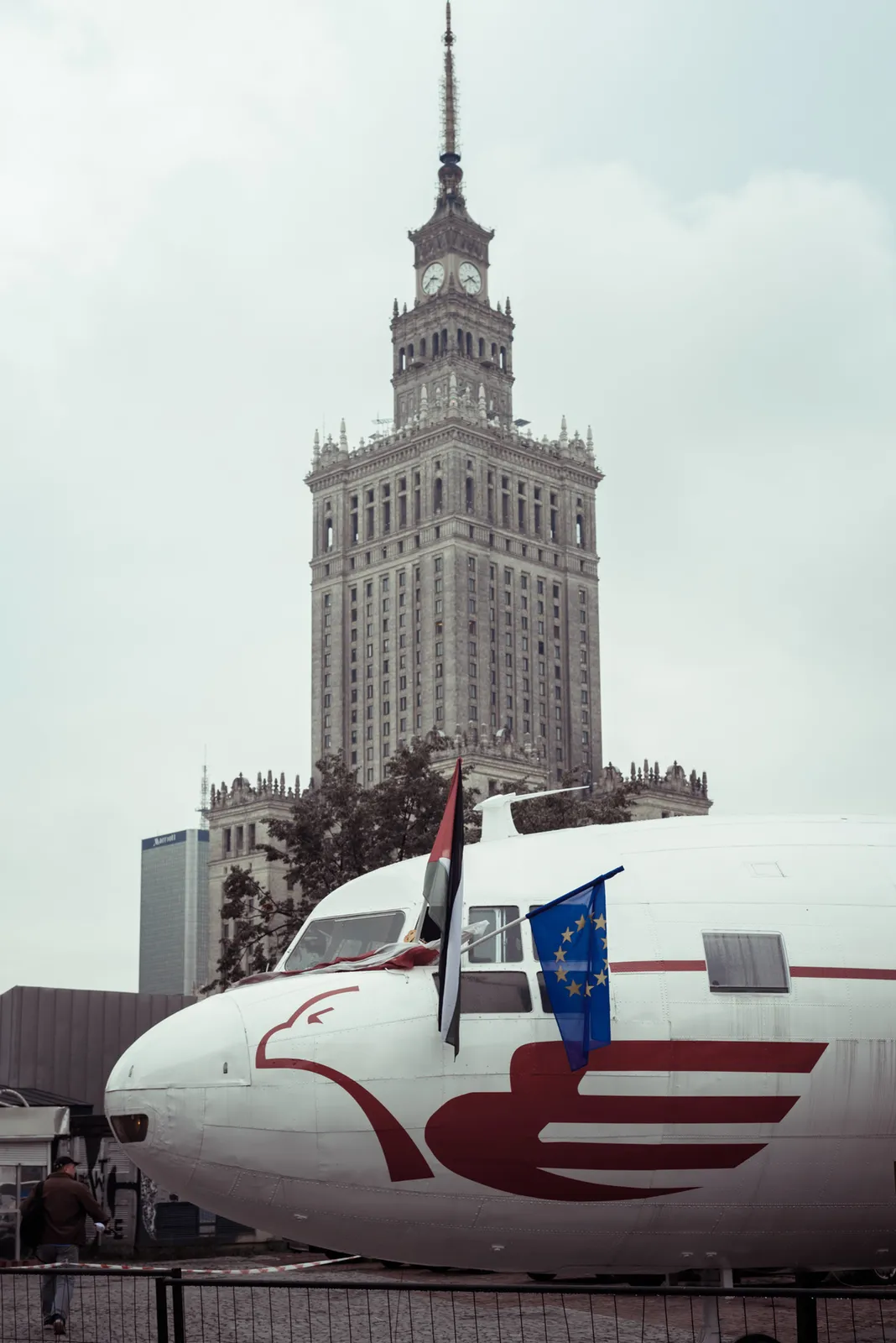 Aircraft nose displayed in front of a tall city building