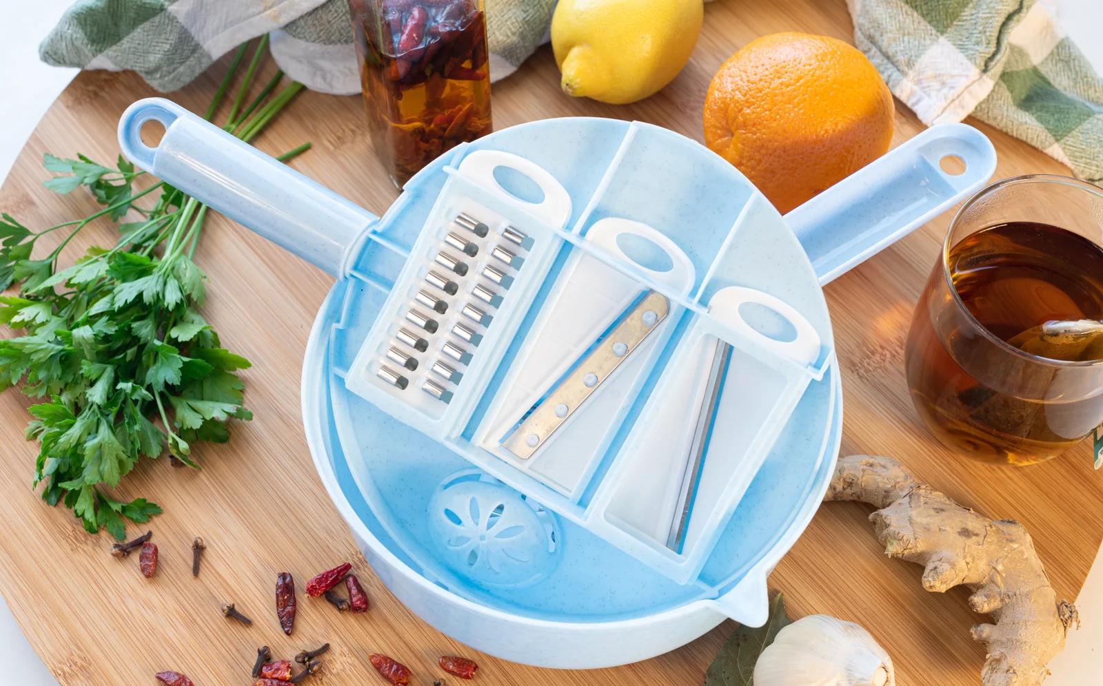 Kitchen tools displayed with fresh ingredients.