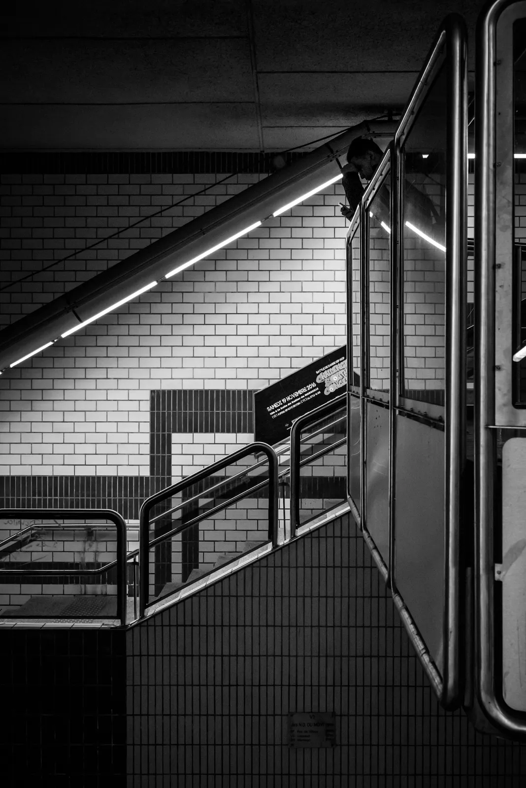 Angular station railings and ceiling lights in black and white