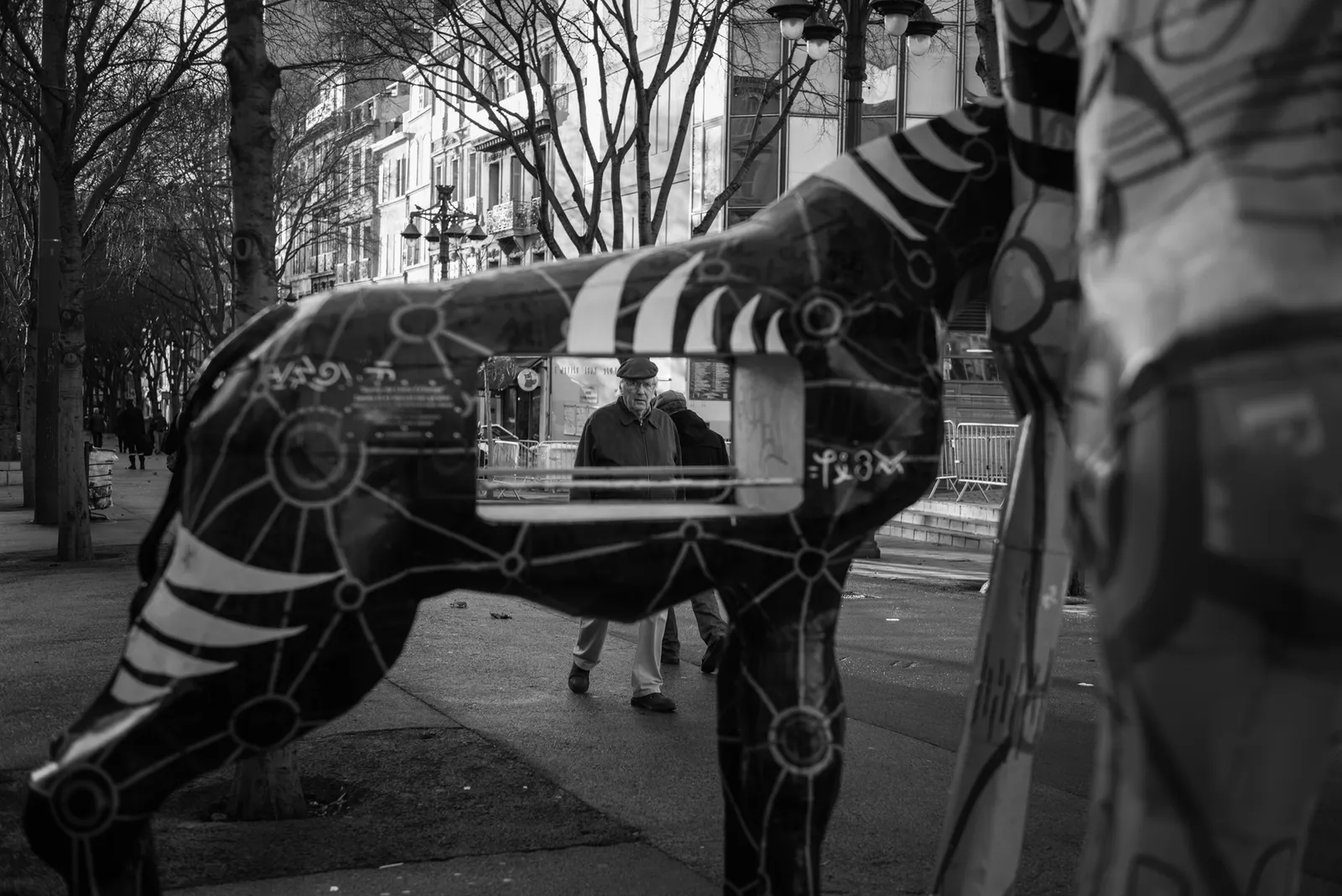Street reflections layered with a painted figure in black and white