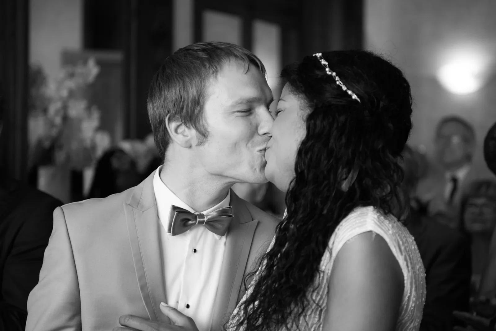 Newlyweds kissing during their ceremony.